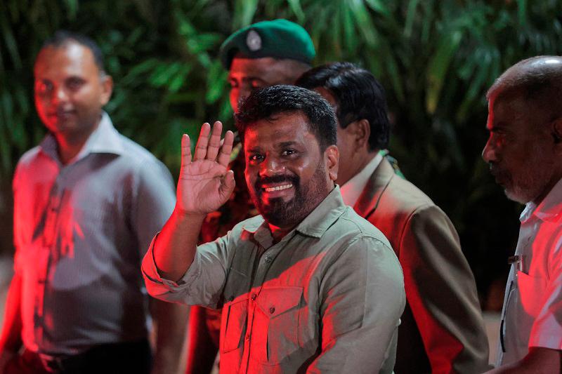 Anura Kumara Dissanayake, leader of the National People’s Power (NPP) party, greets as he leaves the election commission after he claimed the victory in the presidential election, in Colombo, Sri Lanka, September 22, 2024. - REUTERSpix