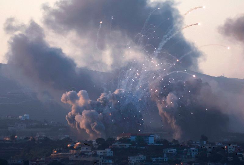 Smoke billows over southern Lebanon following Israeli strikes, amid ongoing cross-border hostilities between Hezbollah and Israeli forces, as seen from Tyre, southern Lebanon September 23, 2024. - REUTERSpix