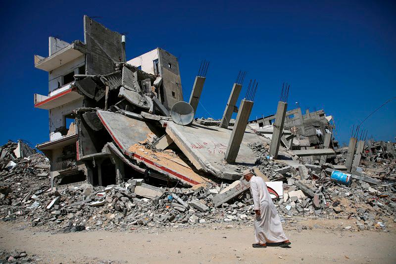 A Palestinian man walks past the rubble of a house destroyed in the Israel’s military offensive, amid the Israel-Hamas conflict, in Khan Younis, in the southern Gaza Strip, September 26, 2024. - REUTERSpix