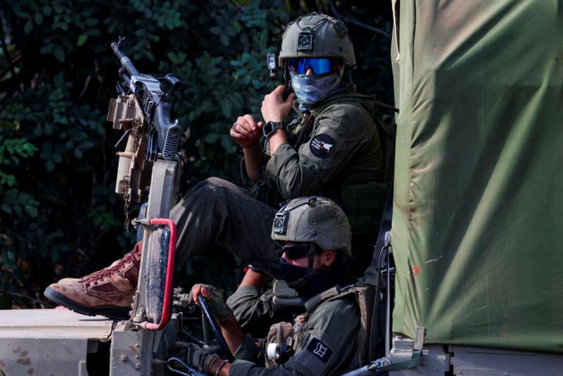 Israeli soldiers ready their kit, amid cross-border hostilities between Hezbollah and Israel, in northern Israel October 1, 2024. - REUTERSPIX