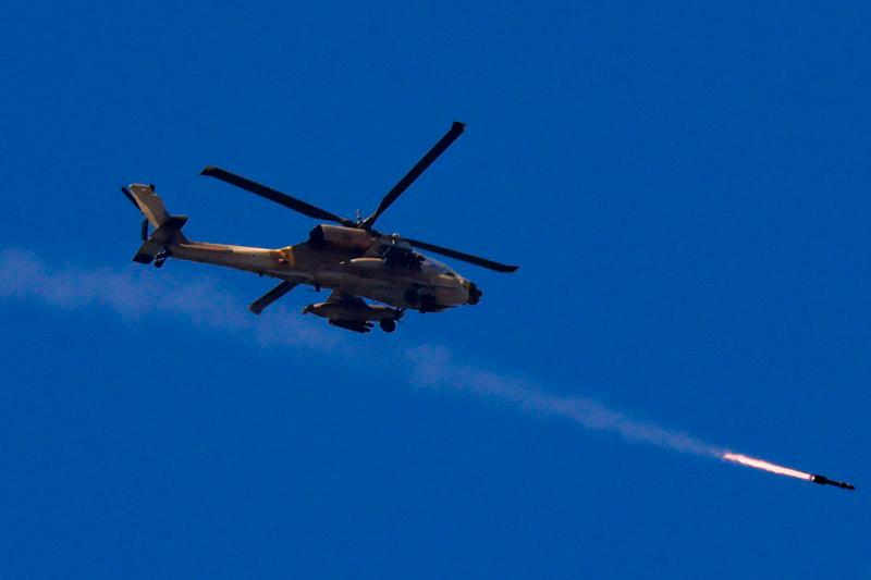 An Israeli Apache attack helicopter fires a missile towards southern Lebanon, amid hostilities between Hezbollah and Israel, as seen from northern Israel, October 4, 2024. - REUTERS/Jim Urquhart