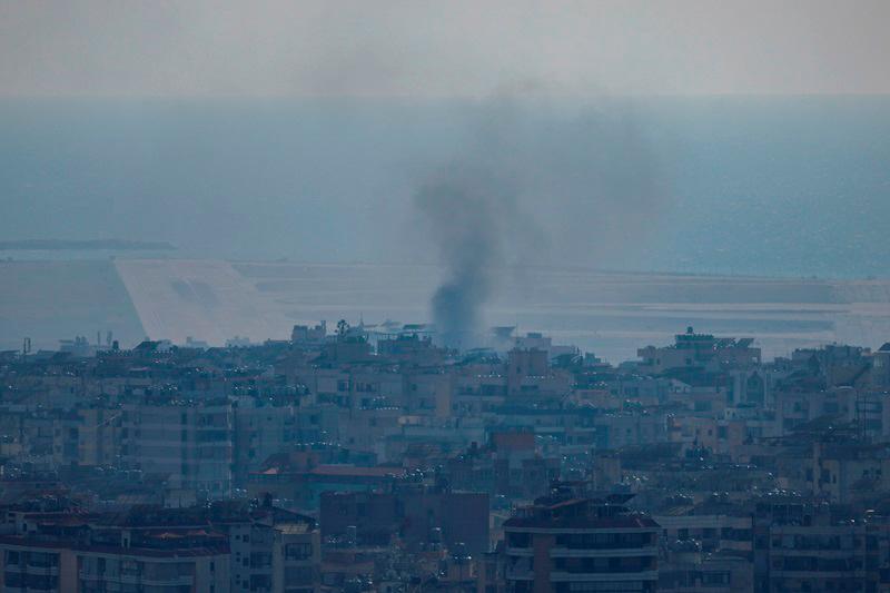 Smoke billows from an Israeli strike near Beirut's Rafic Hariri International Airport, amid the ongoing hostilities between Hezbollah and Israeli forces, in Beirut, Lebanon, October 5, 2024. - REUTERS/Louisa Gouliamaki