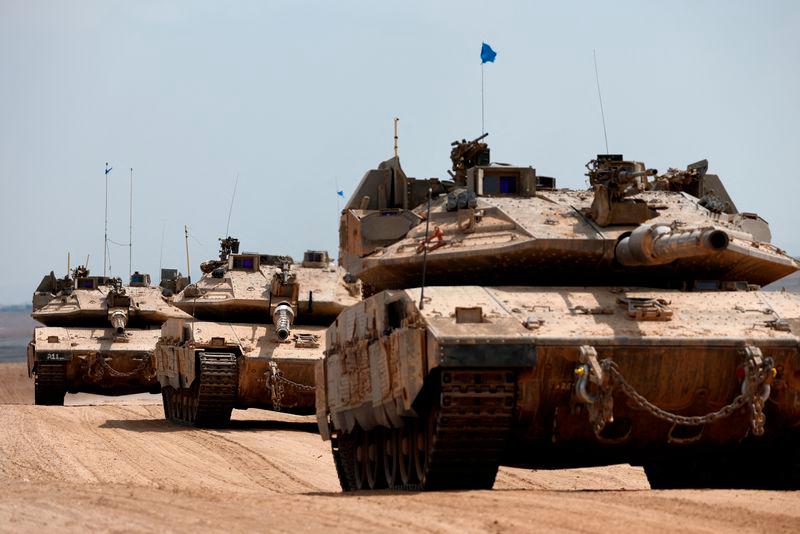 Israeli tanks make their way towards the border with the Gaza Strip, amid the ongoing conflict between Israel and Hamas, in southern Israel, October 6, 2024. - REUTERSPIX