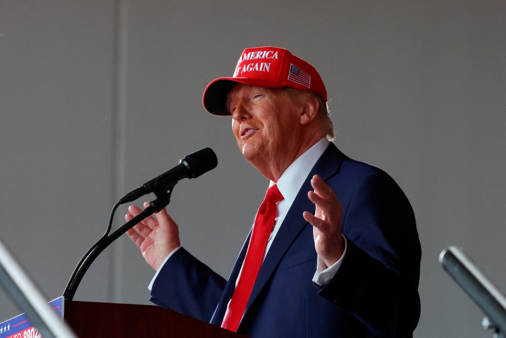 Republican presidential nominee and former U.S. President Donald Trump gestures as he speaks during a rally in Juneau - REUTERSpix