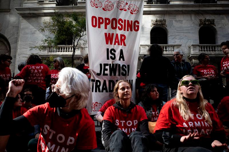 Pro-Palestinian protestors gather at the New York Stock Exchange (NYSE) to protest the ongoing war between Israel and Hamas in New York City, U.S., October 14, 2024. REUTERS.