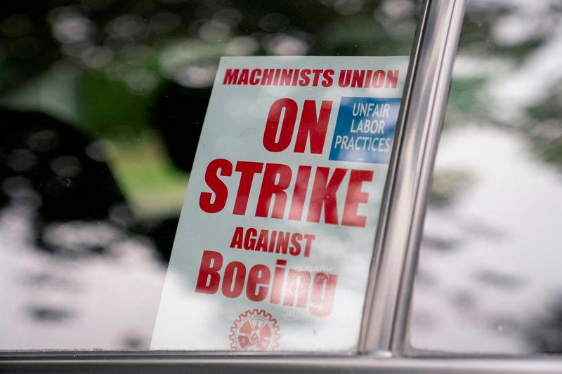 A strike sign is seen in a Boeing worker's car as union members from the International Association of Machinists and Aerospace Workers District 751 arrive to vote on a new contract proposal at a union hall during an ongoing strike in Renton, Washington, U.S. October 23, 2024. - REUTERSPIX