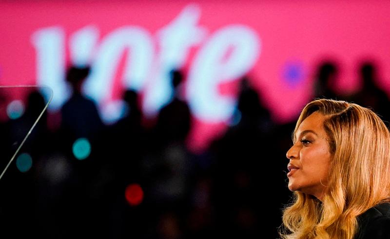 Singer Beyonce speaks as she attends a campaign rally of Democratic presidential nominee U.S. Vice President Kamala Harris, in Houston, Texas, U.S., October 25, 2024. - REUTERS/Kevin Lamarque