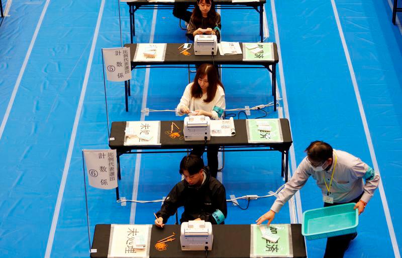 Election officers count ballots for the general election at a ballot counting centre in Tokyo, Japan October 27, 2024. - REUTERSPIX