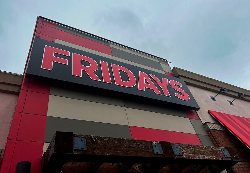 The sign for a locally owned and operated restaurant in the TGI Fridays chain appears from a street view in Everett, Massachusetts, USA on Saturday, November 2, 2024. - REUTERS/Nate Raymond