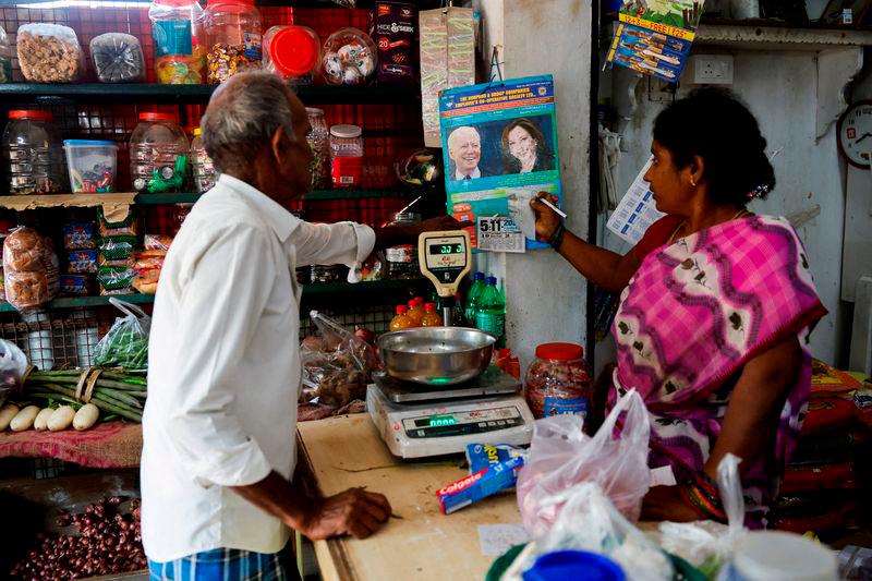 A calendar with images of U.S. President Joe Biden and Democratic presidential nominee, U.S. Vice President Kamala Harris is hung inside a shop in Thulasendrapuram, the village where Harris’ maternal grandfather was born, in the Southern state of Tamil Nadu, India November 5, 2024. Reuterspix