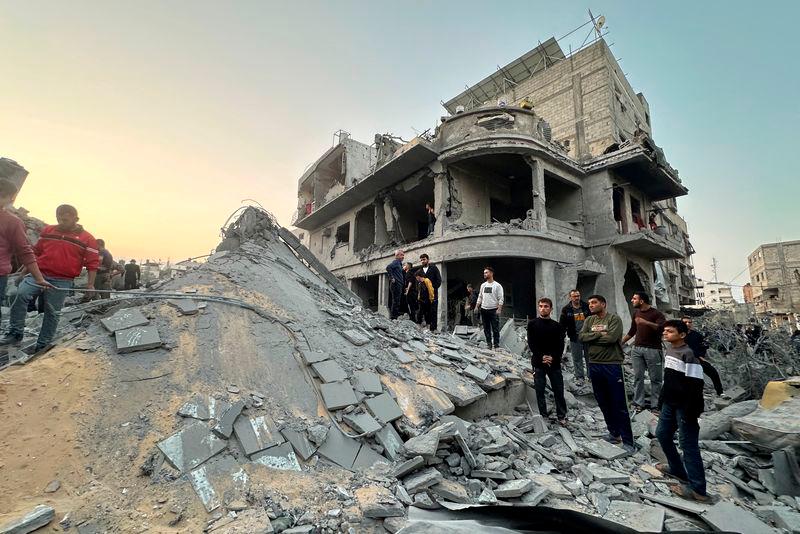 Palestinians gather at the site of an Israeli strike on a house, in Jabalia in the northern Gaza Strip - REUTERSpix