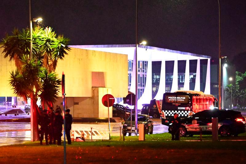 Police vehicles are seen in front of the Brazilian Supreme Court after explosions in the Three Powers Square in Brasilia - REUTERSpix