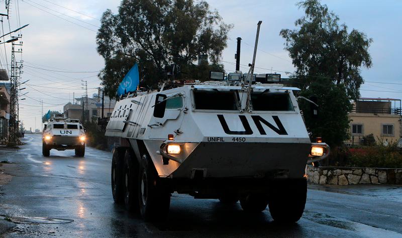 UN peacekeepers (UNIFIL) vehicles ride along a street amid ongoing hostilities between Hezbollah and Israeli forces, in Marjayoun, near the border with Israel, southern Lebanon November 19, 2024. - REUTERS/Karamallah Daher