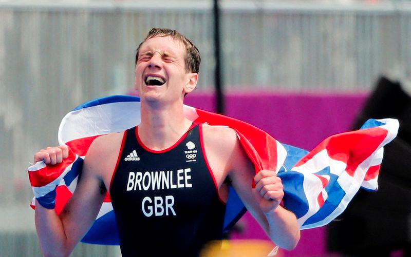 Britain's Alistair Brownlee celebrates after winning in the men's triathlon final during the London 2012 Olympic Games at Hyde Park August 7, 2012. - REUTERSPIX