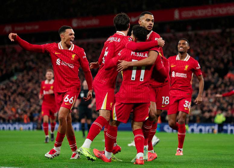 Premier League - Liverpool v Manchester City - Anfield, Liverpool, Britain - December 1, 2024 Liverpool's Cody Gakpo celebrates scoring their first goal with Mohamed Salah and Dominik Szoboszlai - REUTERSPIX