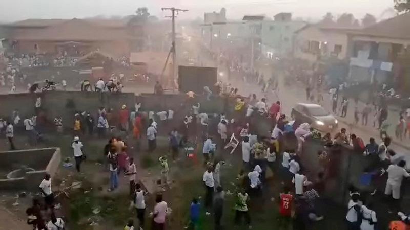 People scramble in Nzerekore, Guinea, where local officials said a deadly stampede ensued at a stadium following fan clashes during a soccer match, December 1, 2024, in this still image obtained from a social media video. - Social media via REUTERS