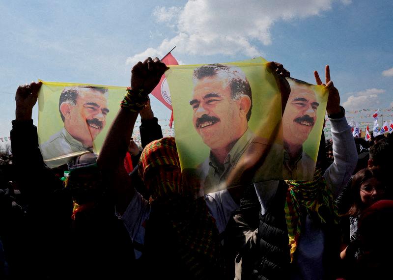 Supporters of the pro-Kurdish Peoples’ Equality and Democracy Party (DEM Party) display flags with a portrait of jailed Kurdistan Workers Party (PKK) leader Abdullah Ocalan, in Istanbul, Turkey, March 17, 2024. REUTERS/Umit Bektas/File Photo