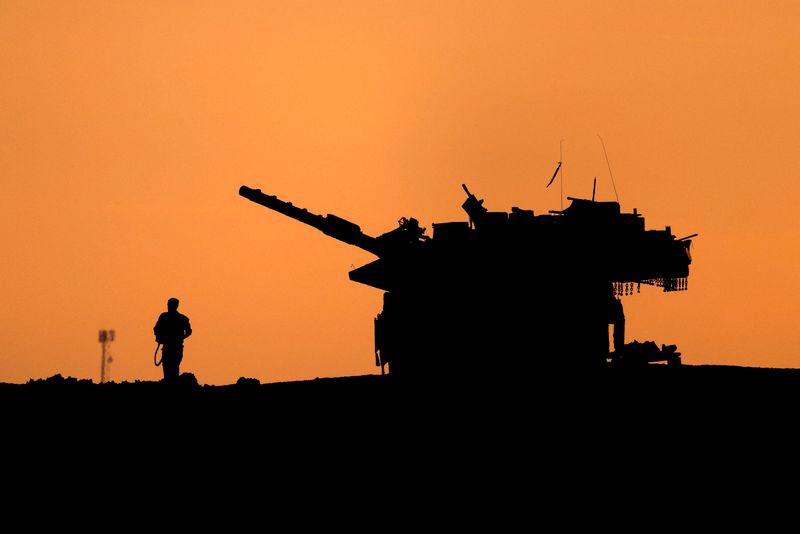 The silhouettes of a military vehicle and a soldier are seen near the Gaza border, amid the ongoing conflict in Gaza between Israel and Hamas, in Israel, December 16, 2024. - REUTERSPIX