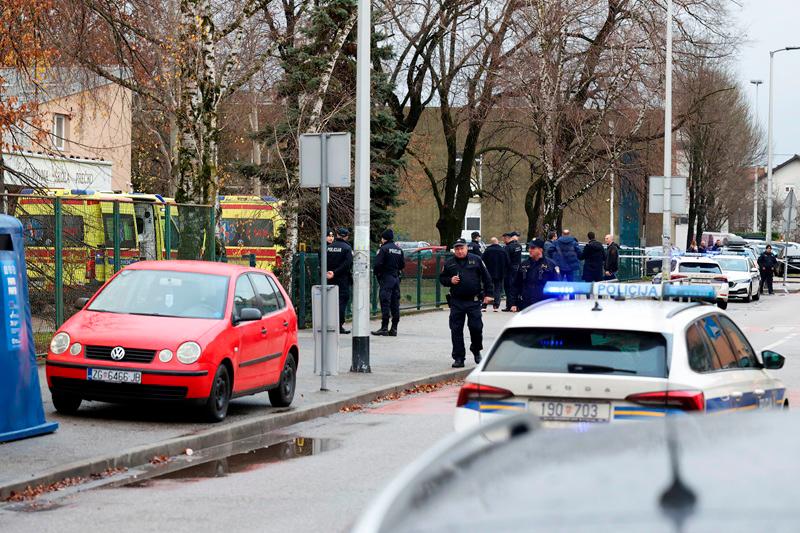 Police officers work, following a knife attack in a primary school, in Zagreb, Croatia, December 20, 2024. - REUTERS/Antonio Bronic