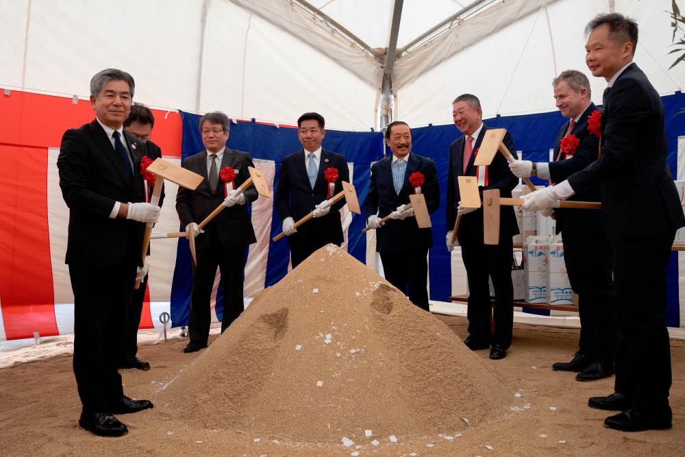 Tan (fourth from right) at the groundbreaking ceremony today