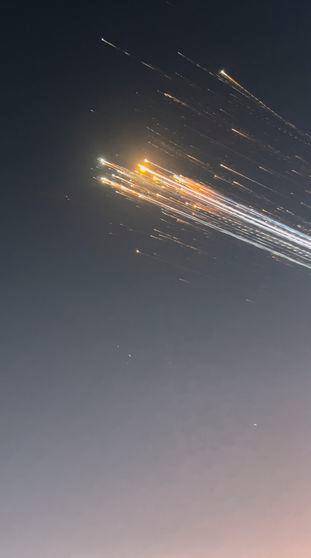 Orange balls of light fly across the sky as debris from a SpaceX rocket launched in Texas is spotted over Turks and Caicos Islands, January 16, 2025 in this screen grab obtained from social media video. Marcus Haworth@marcusahaworth/via REUTERS