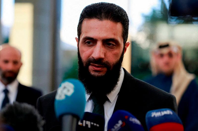 Syria's de facto leader Ahmed al-Sharaa, also known as Abu Mohammed al-Golani, speaks to the media during a meeting with Qatar's Minister of State Mohammed bin Abdulaziz Al-Khulaifi, after the ousting of Syria's Bashar al-Assad, in Damascus, Syria, December 23, 2024. - REUTERS/Ammar Awad/File Photo