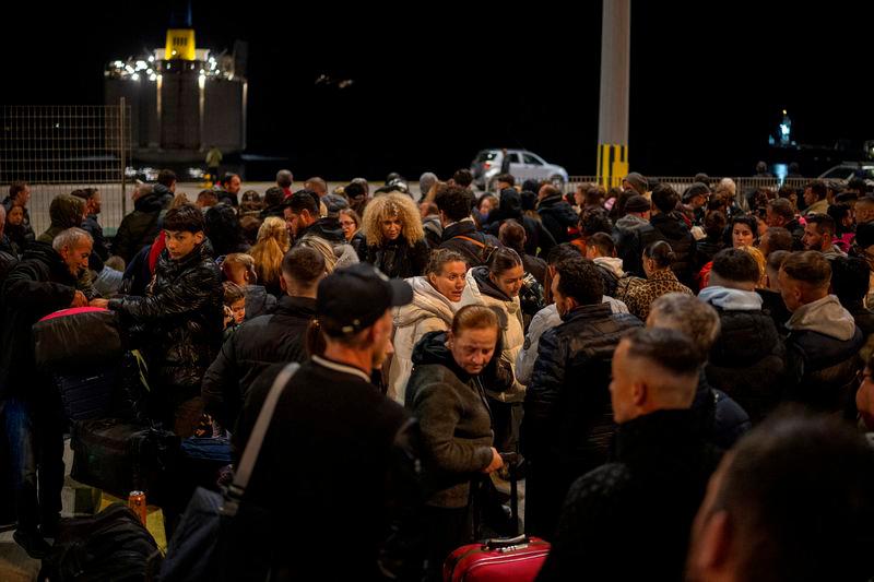 People wait to board a ferry to Piraeus, following an increased seismic activity on the island of Santorini - REUTERSpix