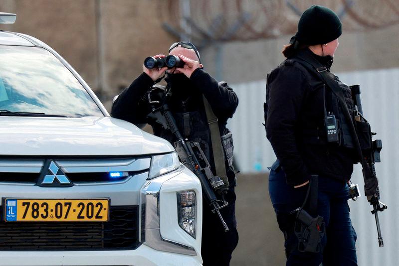 Members of Israeli forces stand guard outside the Israeli military prison, Ofer, on the day Israel is expected to release Palestinian prisoners as part of a hostages-prisoners swap and a ceasefire deal in Gaza between Hamas and Israel, near Ramallah, in the Israeli-occupied West Bank, February 8, 2025. - REUTERSPIX