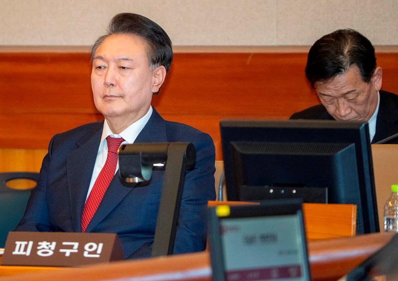 South Korea’s impeached President Yoon Suk Yeol attends the hearing of his impeachment trial over his short-lived imposition of martial law, at the Constitutional Court in Seoul, South Korea, February 20, 2025. - SONG KYUNG-SEOK/Pool via REUTERS