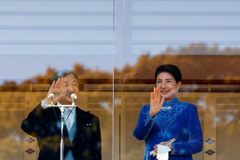 Japanese Emperor Naruhito and Empress Masako wave their hands to well-wishers from a balcony at the Imperial Palace in Tokyo, Japan February 23, 2025. REUTERSpix