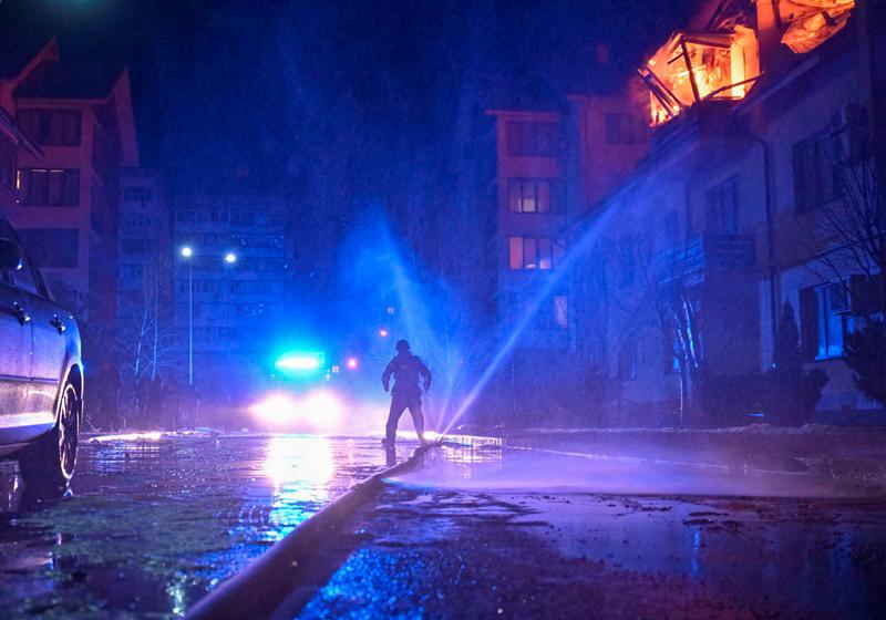 A firefighter works at a site of an apartment building hit by a Russian drone strike, amid Russia's attack on Ukraine, in Zaporizhzhia, Ukraine March 1, 2025. - REUTERS/Stringer