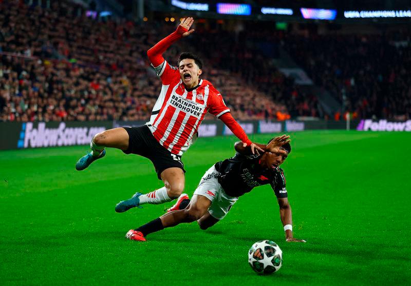 PSV Eindhoven’s Richard Ledezma in action with Arsenal’s Myles Lewis-Skelly. REUTERS Pix