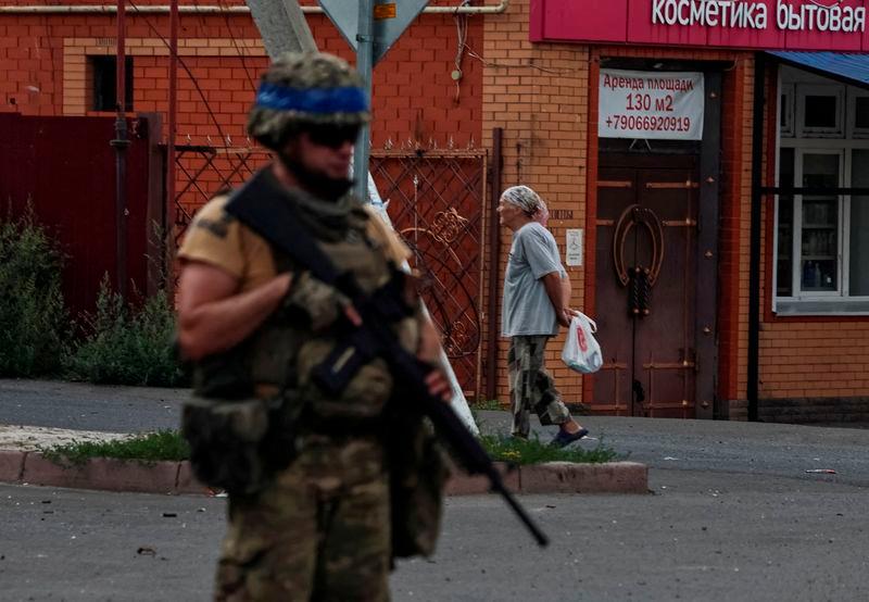 A Ukrainian serviceman patrols an area in the controlled by Ukrainian army town of Sudzha, Kursk region - REUTERSpix