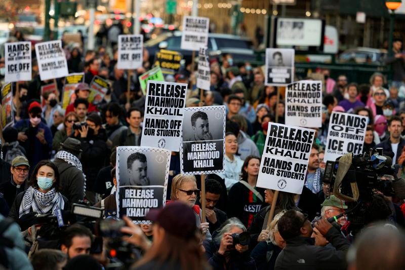 Demonstrators hold placards during a protest following the arrest by US immigration agents of Palestinian student protester Mahmoud Khalil at Columbia University, at Foley Square in New York City - REUTERSpix