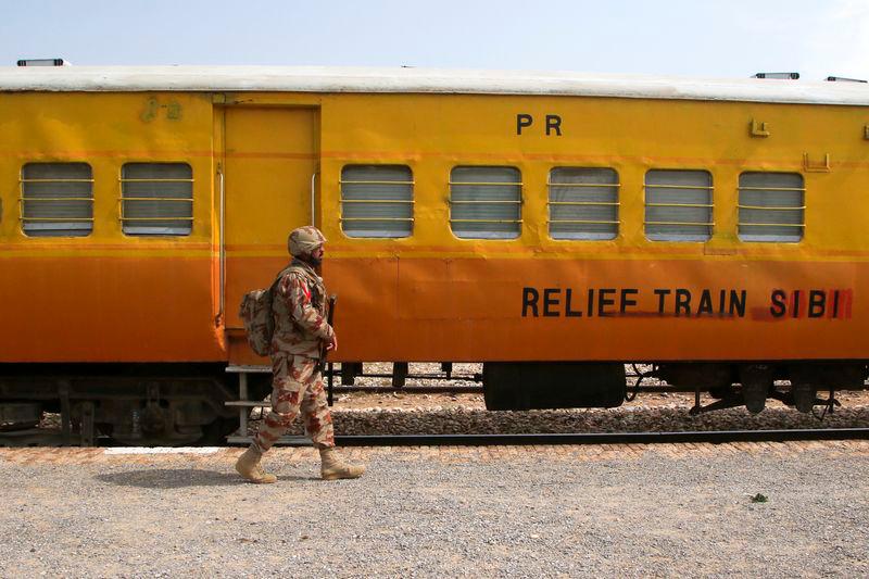 A Pakistan Army soldier walks next to a rescue train, after the attack on a train by separatist militants in Bolan, at the railway station in Mushkaf, Balochistan, Pakistan, REUTERSpix