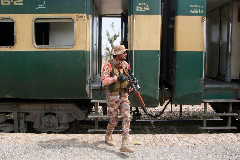 A Pakistan Army soldier stands guard next to a rescue train, after the attack on a train by separatist militants in Bolan, at the railway station in Mushkaf, Balochistan, REUTERSpix