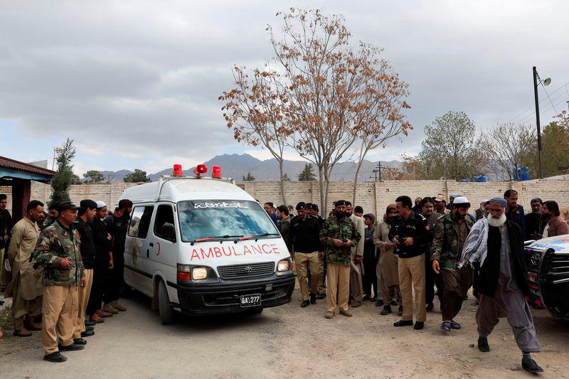 People gather next to an ambulance carrying the bodies of people, who were killed after a train was attacked by separatist militants in Bolan, during the funeral in Quetta, Pakistan, March 13, 2025. - REUTERSPIX