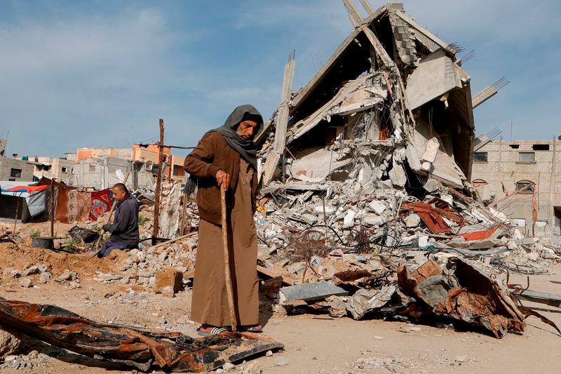 A Palestinian man walks near rubble of houses destroyed during the Israeli offensive, in Rafah, in the southern Gaza Strip. REUTERSpix