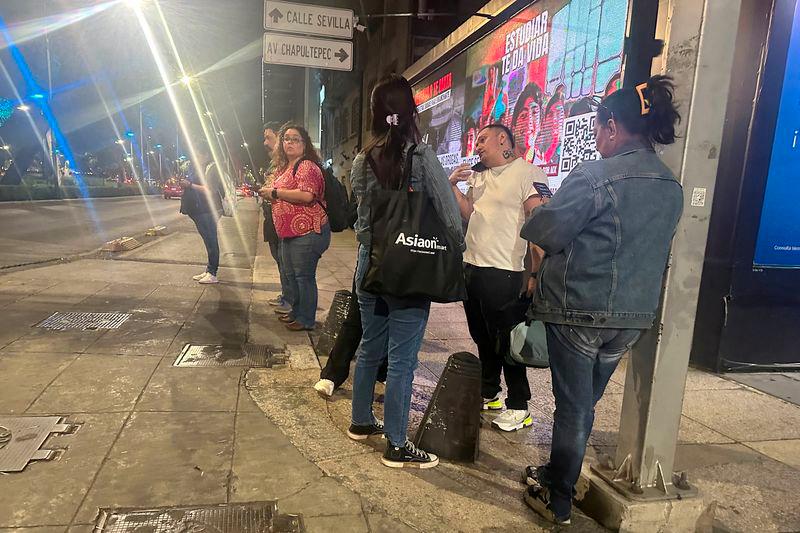 People wait outside their homes and buildings after an alarm warning of a tremor sounded, in Mexico City, Mexico, March 14, 2025. - REUTERSPIX