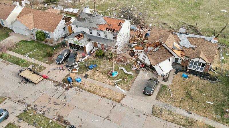 Debris lies around damaged houses the morning after a tornado touched down in Florissant, Missouri, U.S. March 15, 2025. - REUTERSPIX