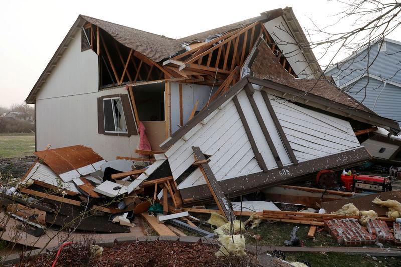 Debris lies around a damaged home the morning after a tornado touched down in Florissant, Missouri, U.S. REUTERSpix