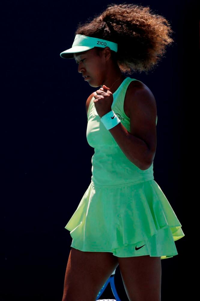 Naomi Osaka (JPN) reacts after winning a point against Yulia Starodubtseva (UKR) (not pictured) on day one of the Miami Open at Hard Rock Stadium. Mandatory Credit: Geoff Burke. REUTERSpix