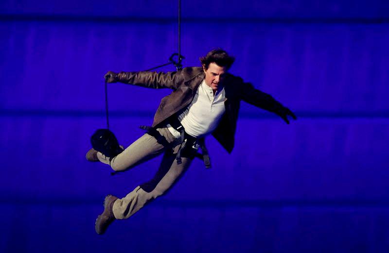 ctor Tom Cruise jumps from the roof of the Stade de France during the closing ceremony. REUTERSpix