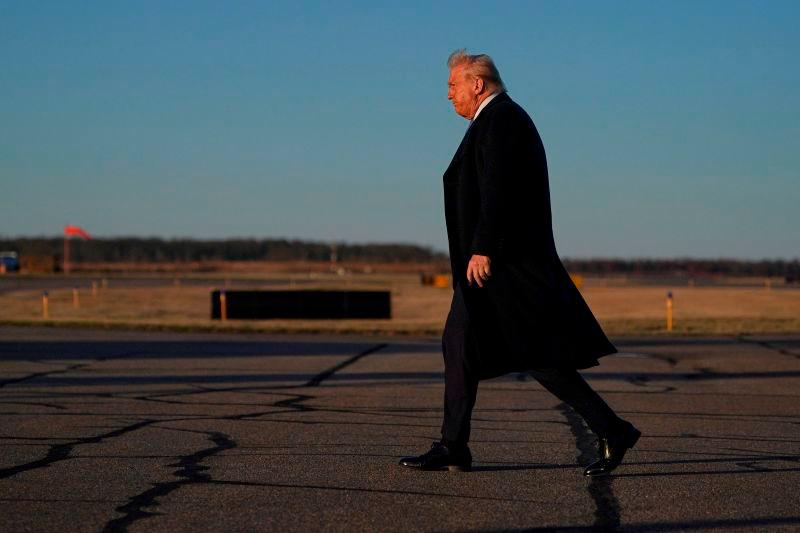 Trump walks at Morristown Municipal Airport in Morristown, REUTERSpix