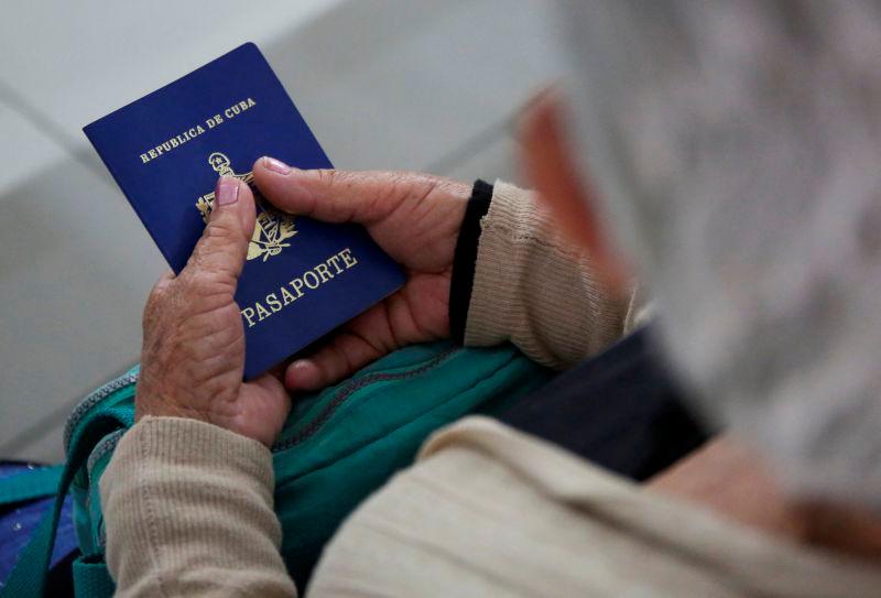 For representational purpose- A migrant woman from Cuba holds her passport while applying for a permit to transit through Honduras, at the Irregular Migrant Attention Center, in Danli, Honduras March 21, 2025. REUTERSpix