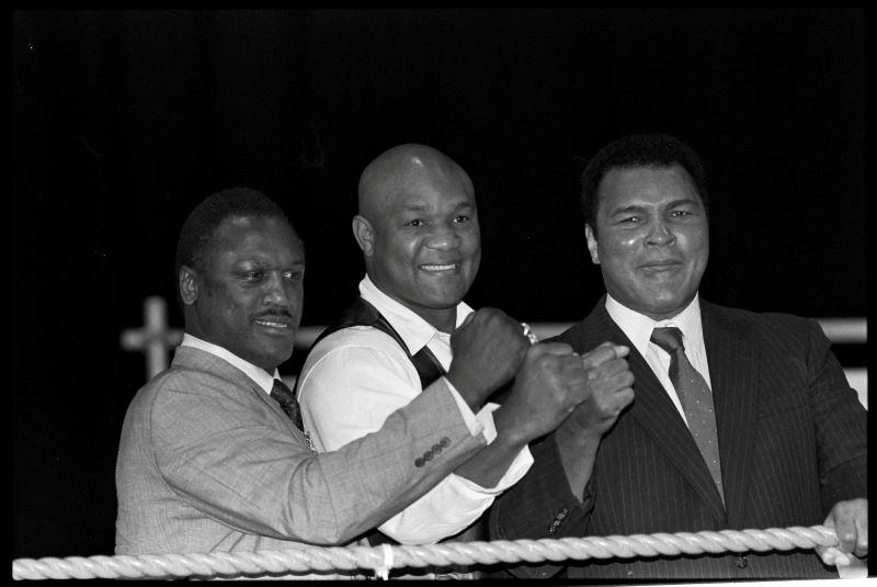 Boxers Joe Frazier, George Foreman and Muhammad Ali, raise fists at launch of film Champions Forever exploring their lives London. October 17, 1989 REUTERSpix