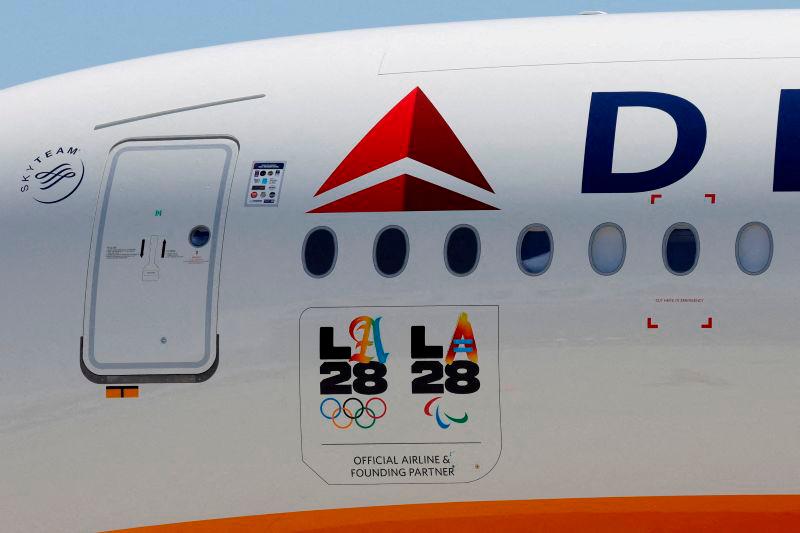 FILEpix: LA28 logos are seen on a Delta Airlines jet carrying American athletes and officials and the Olympic flag as it arrives in Los Angeles, California, U.S. August 12, 2024. REUTERS