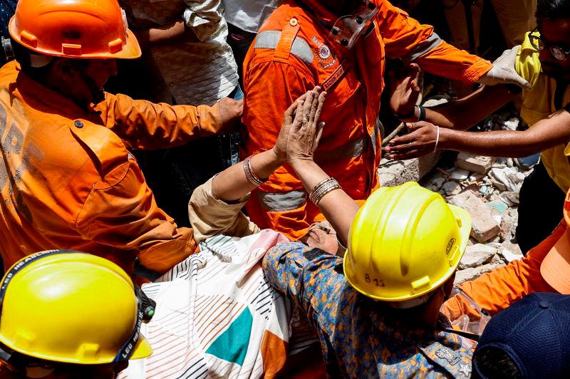Emergency personnel carry a person on a stretcher at the site of a collapsed building in New Delhi, India, April 19, 2025. REUTERSpix