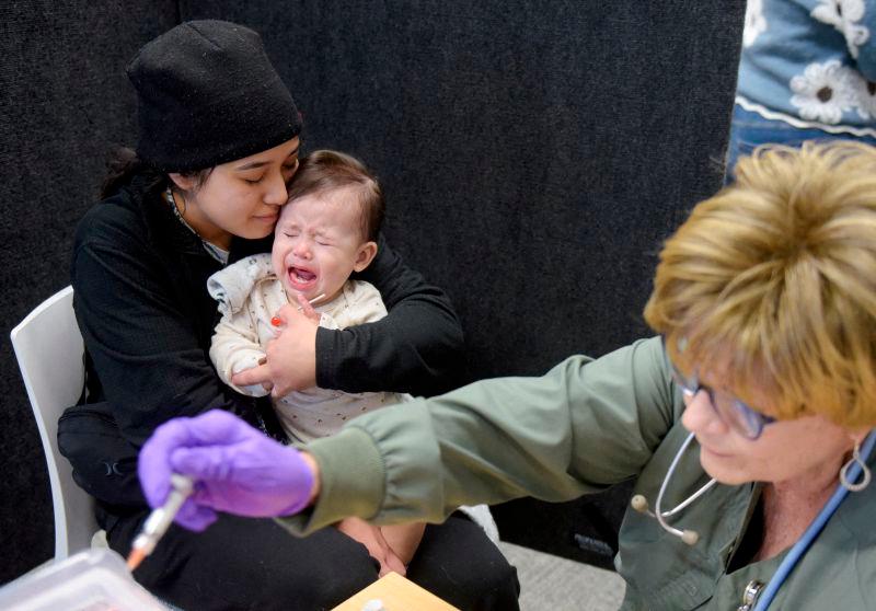 For visual purposes only - FILEpix: Devonay Pena comforts her 13-month-old daughter, Jaqi Herrera, after Herrera received her first dose of the MMR vaccine at the City of Lubbock Health Department in Lubbock, Texas, U.S. February 27, 2025.