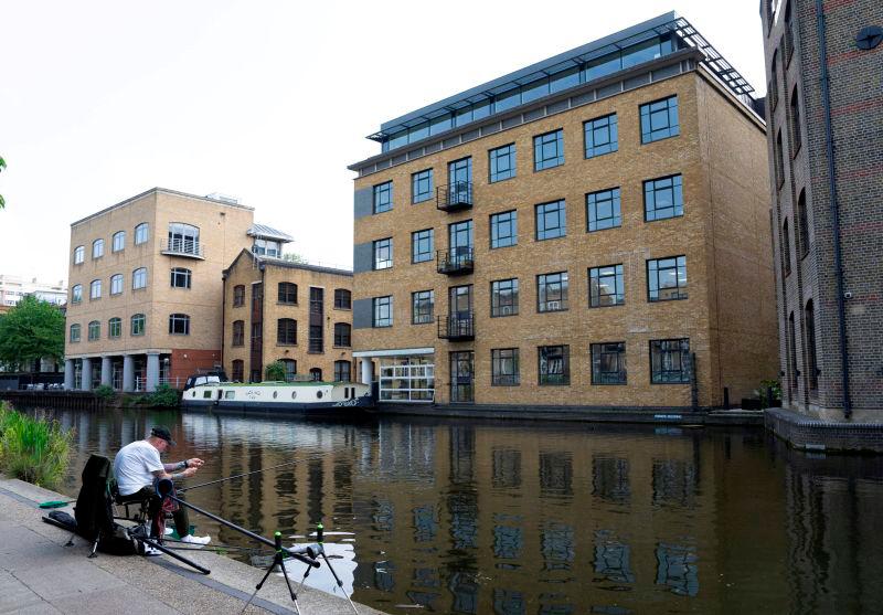A man fishes during good weather in Regent’s Canal in London, Britain, May 2, 2025. REUTERSpix